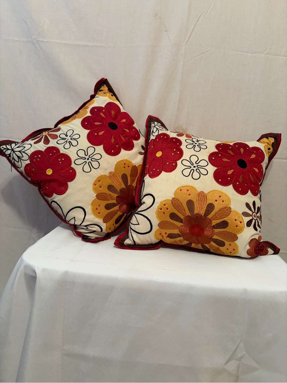 Pier 1 Imports pillows vibrant floral embroidery in red and gold